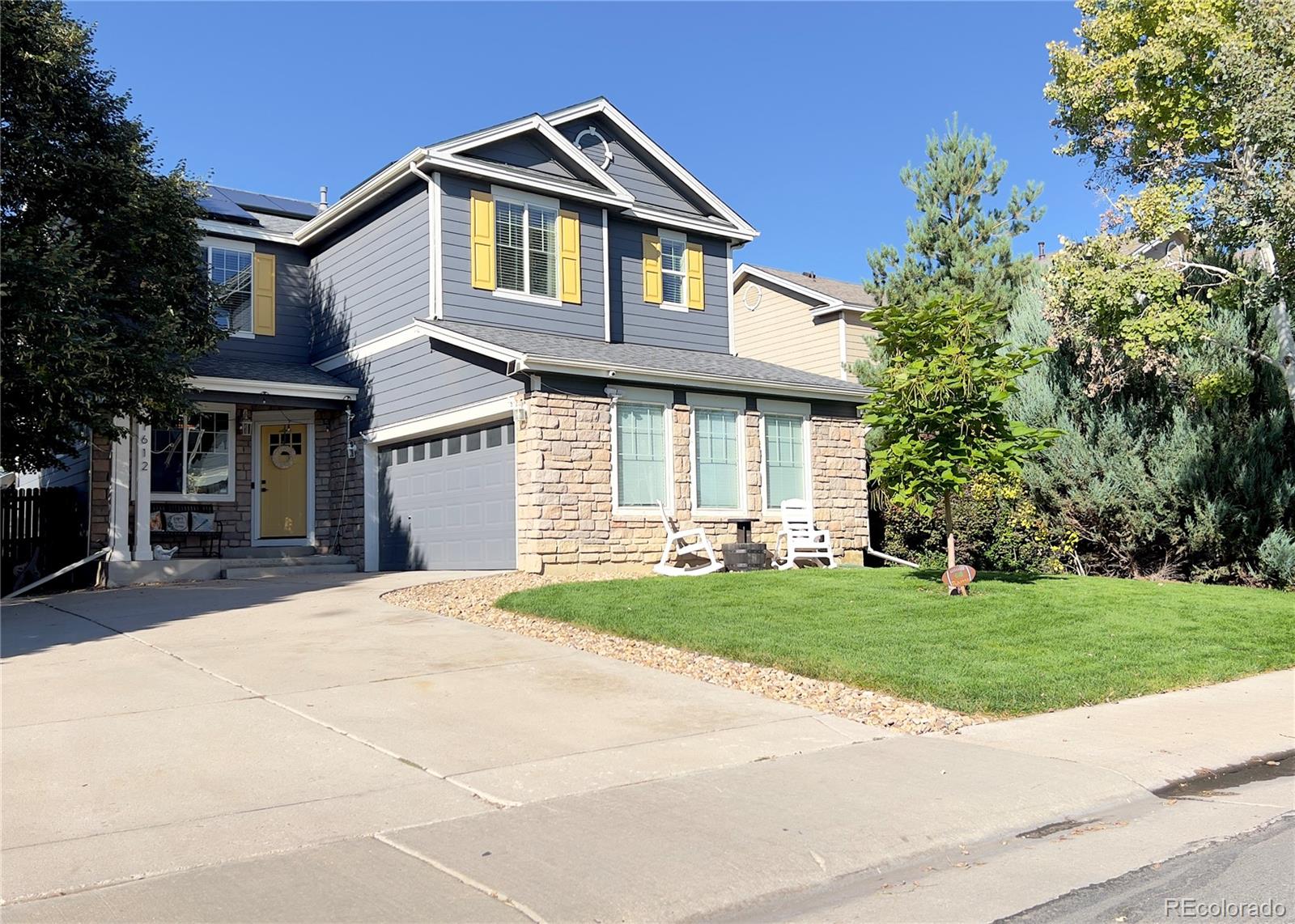 a front view of a house with a yard