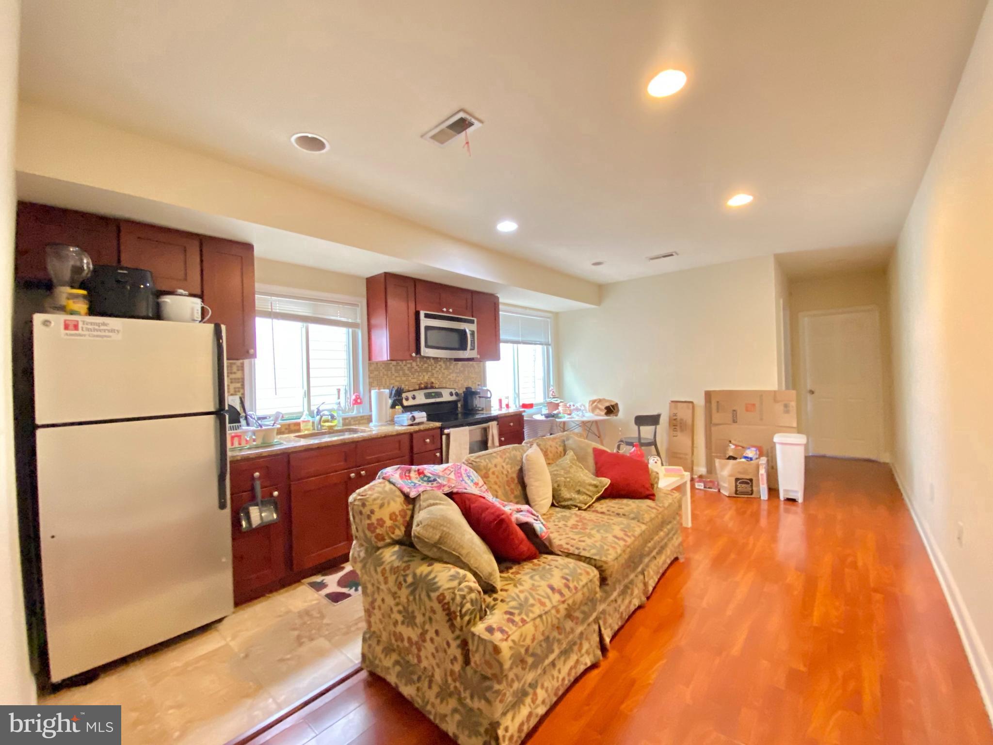 a living room with furniture and a table