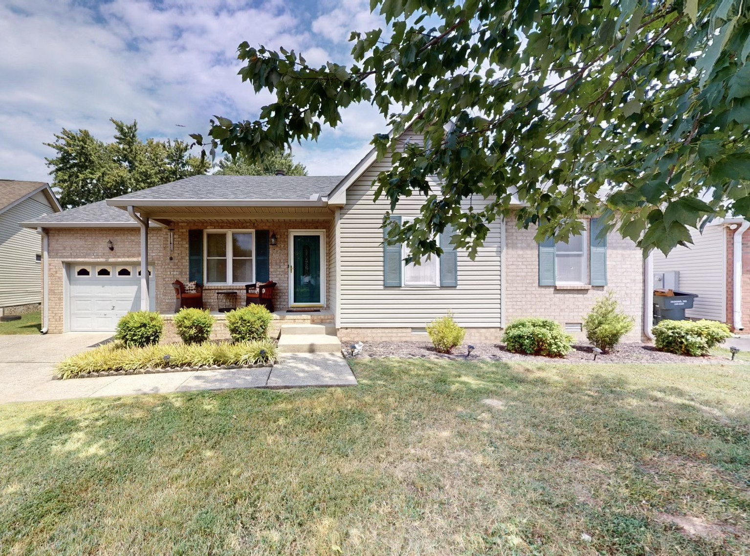 a front view of a house with a yard