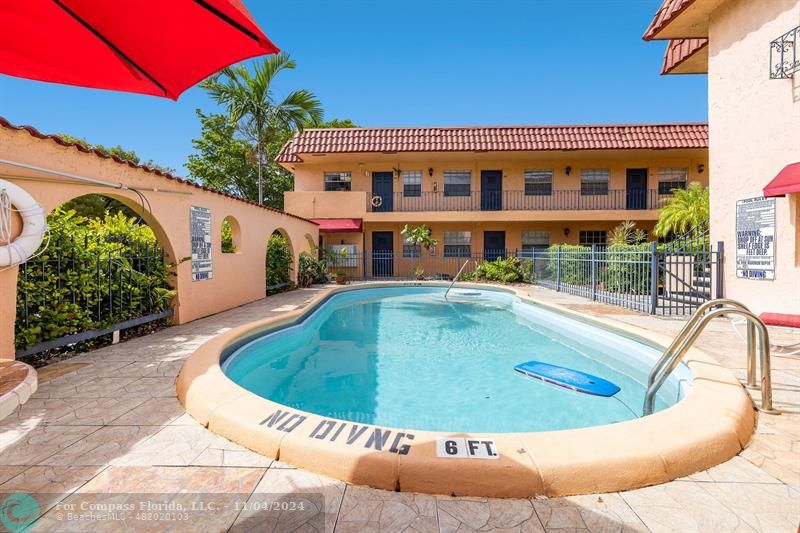 a view of swimming pool with seating space