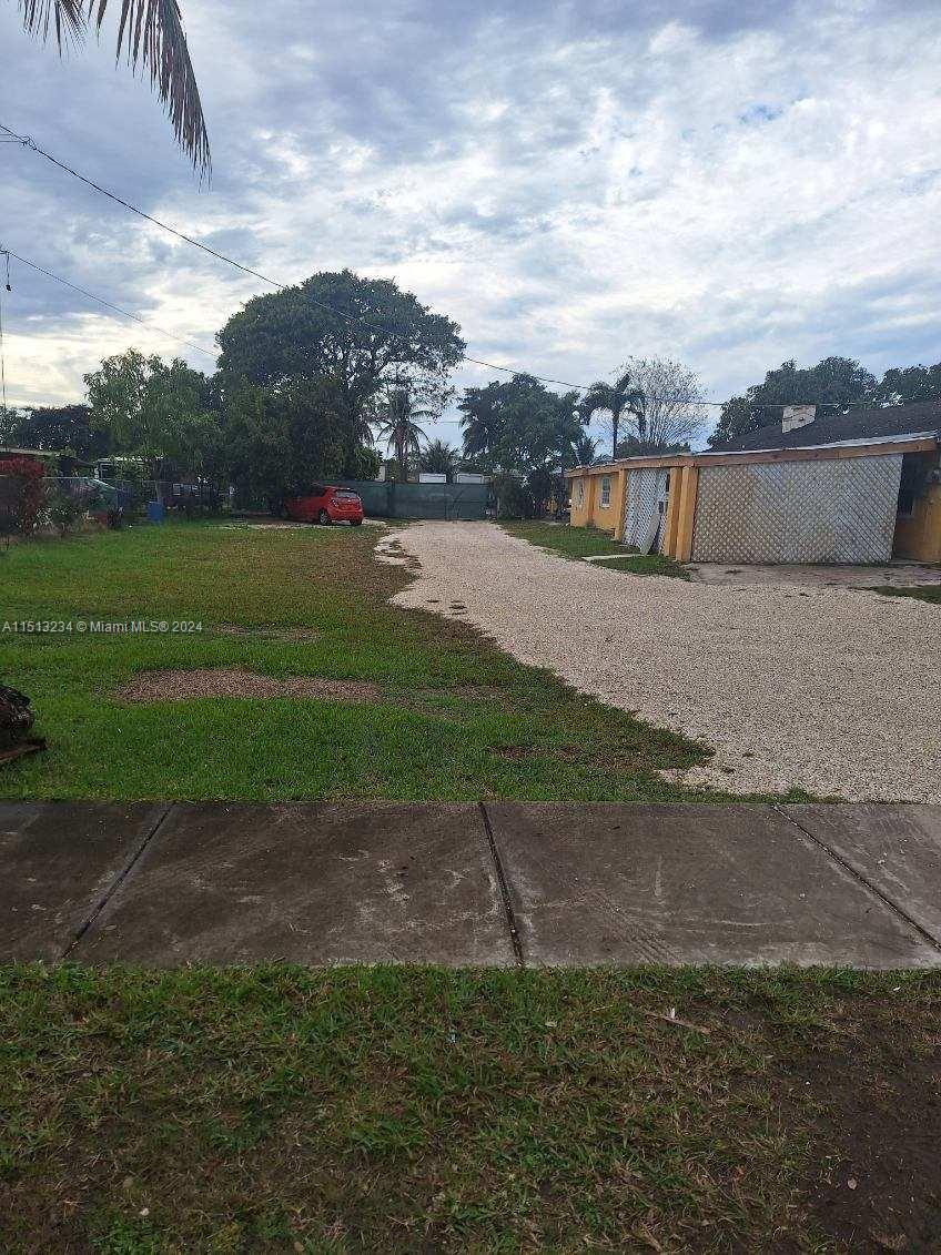 a view of a field with a big yard