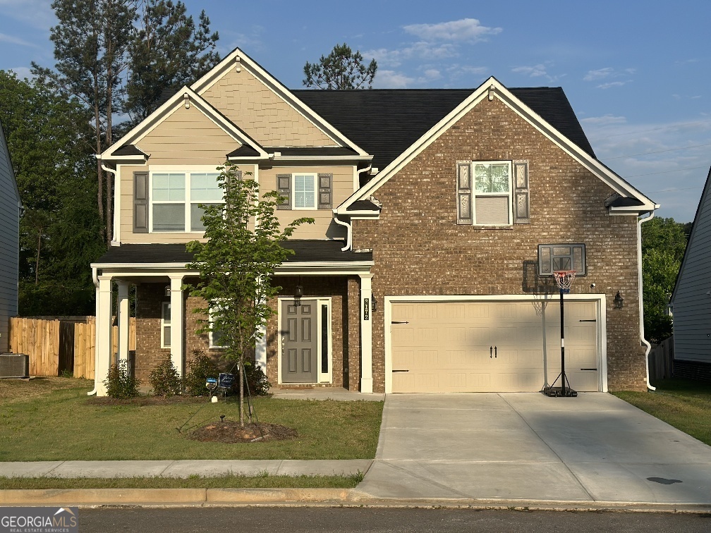 a front view of a house with a yard