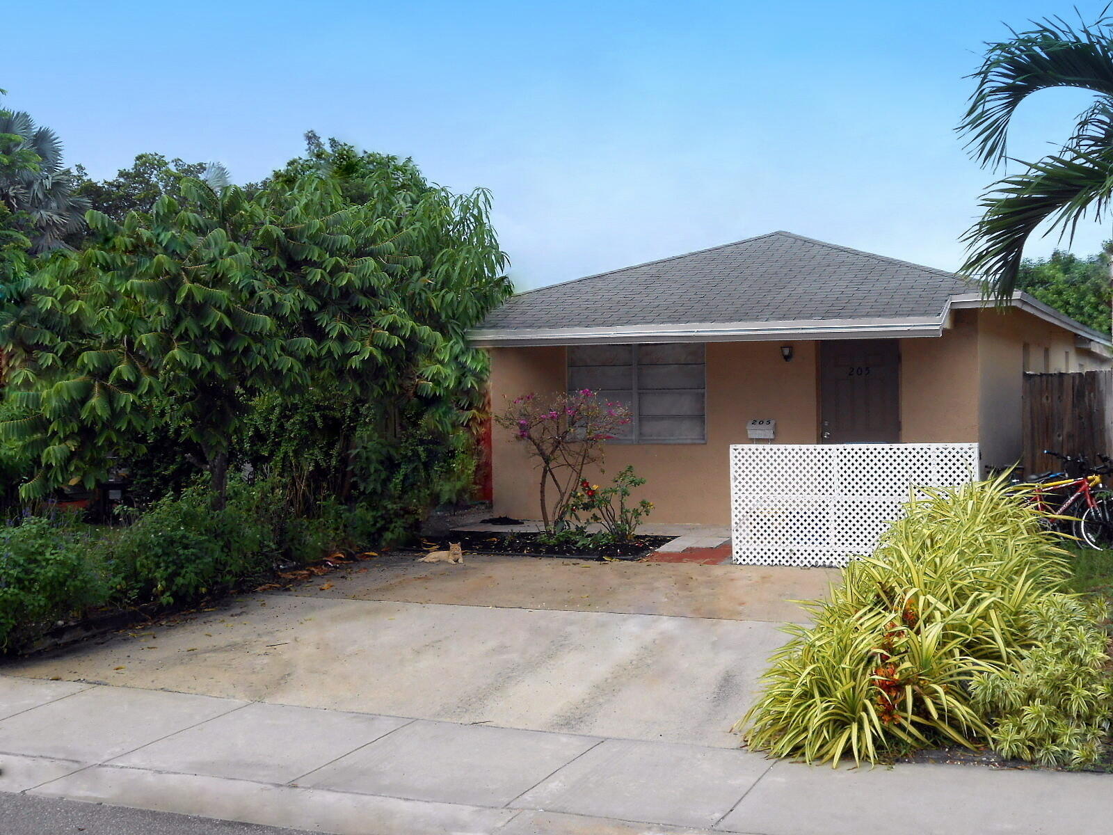 a front view of a house with garden