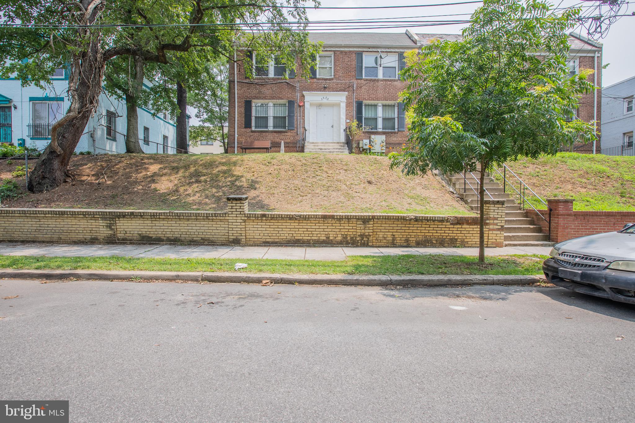 a house view with a sitting space and garden