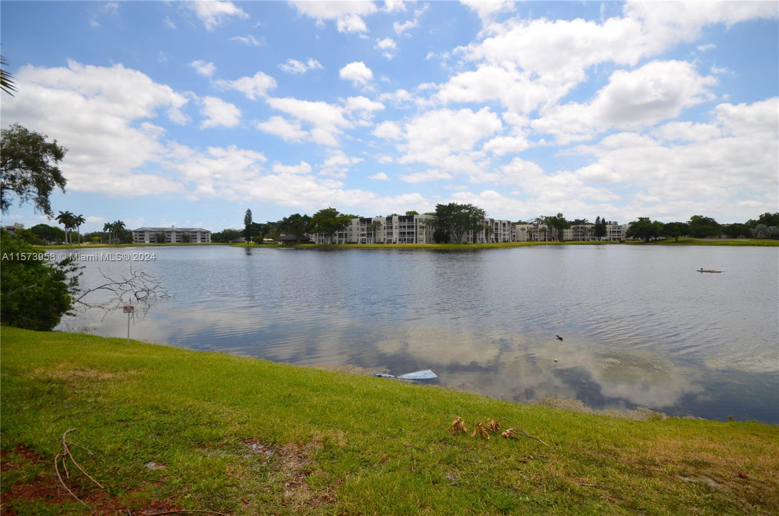 a view of a lake with houses in the background