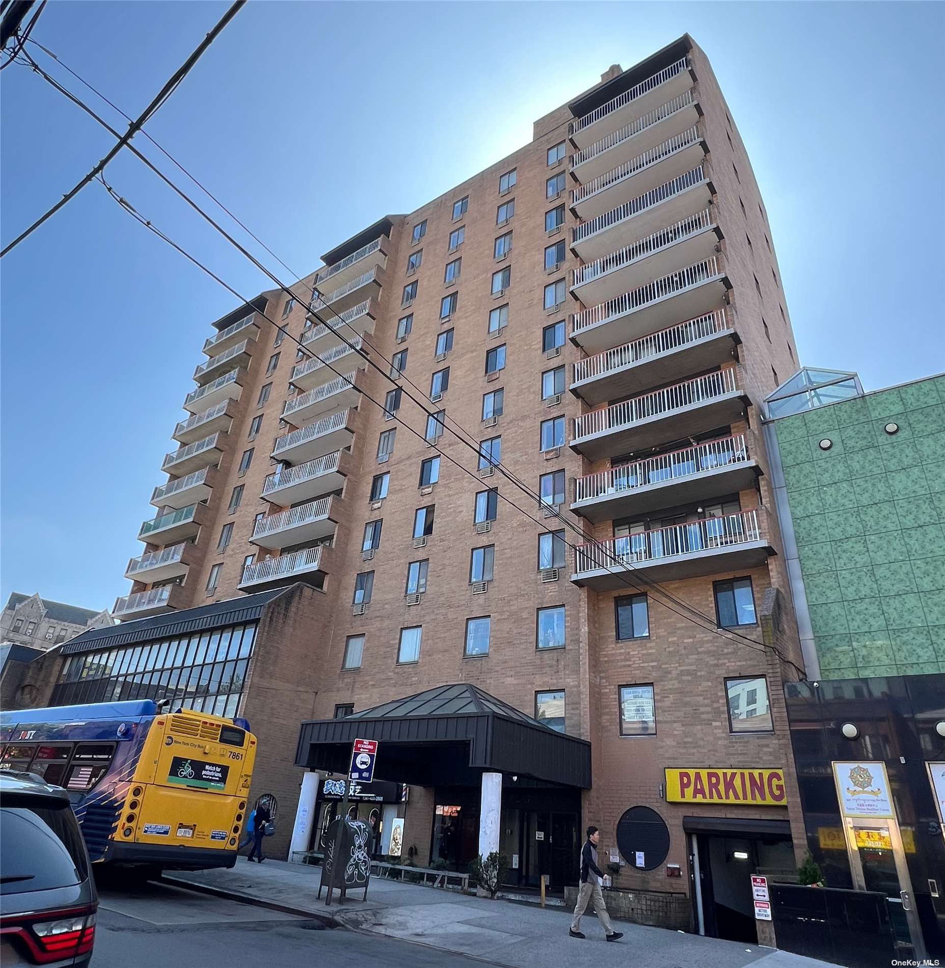 a front view of a building with parking space