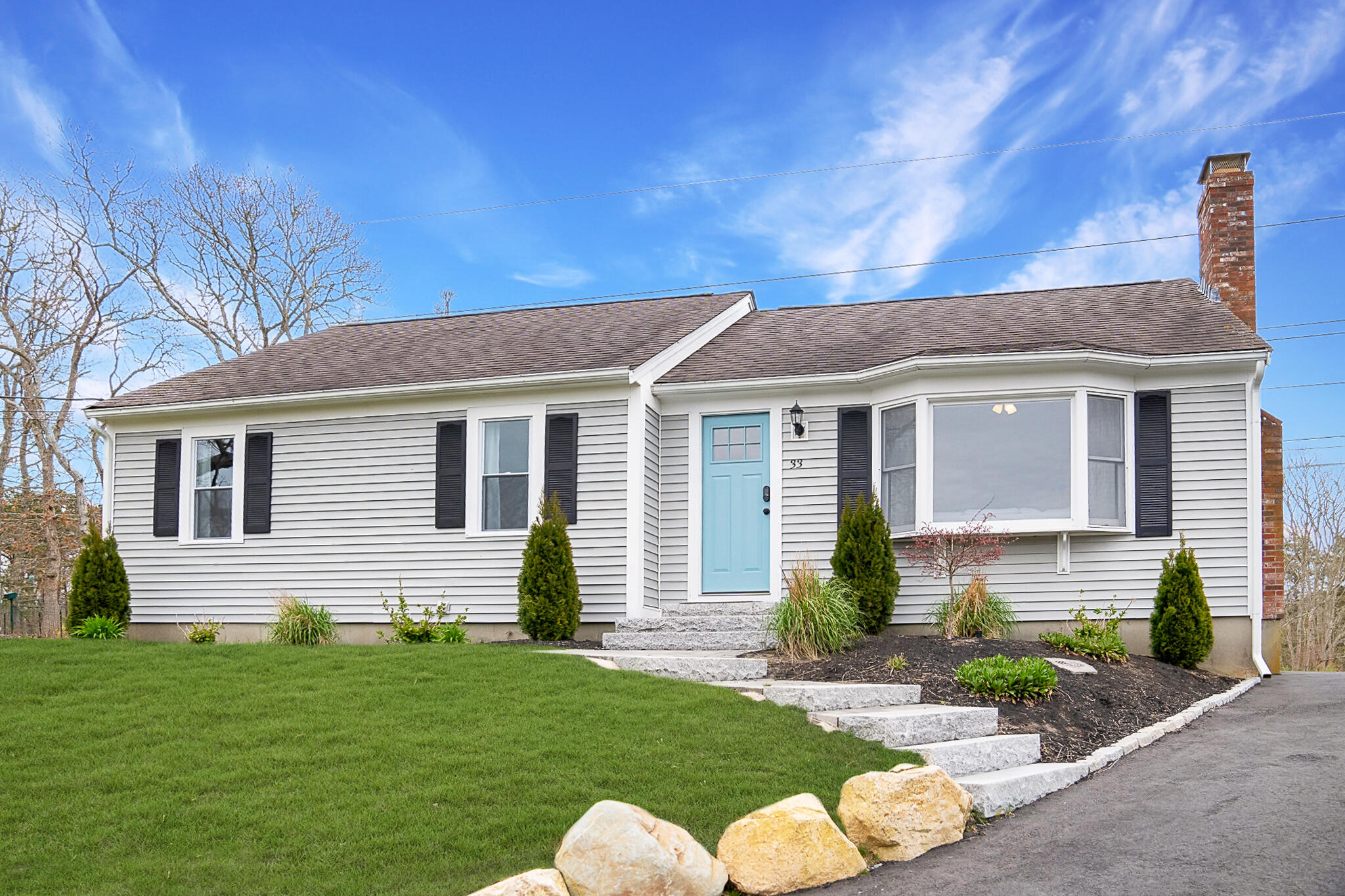 a front view of a house with a yard