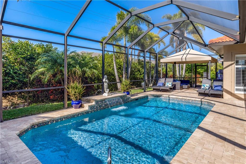 a view of a swimming pool with a patio