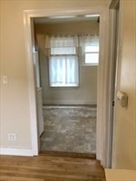 a bathroom with a glass door shower