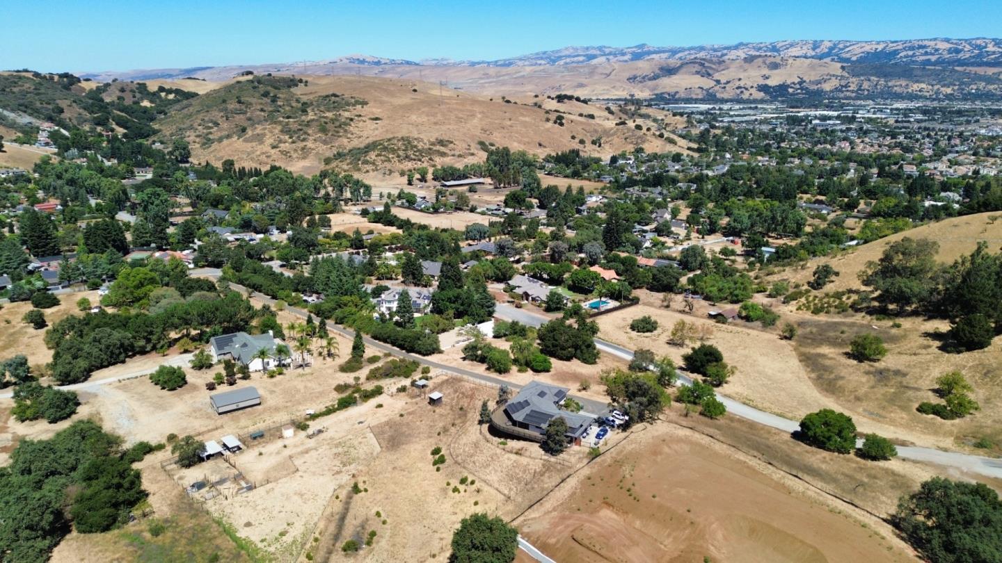 an aerial view of a house with a yard