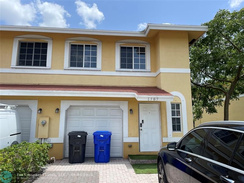 a car parked in front of a house