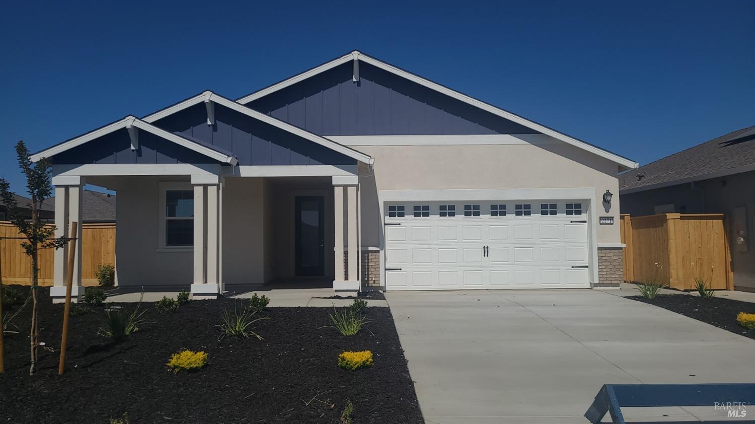 a front view of a house with yard