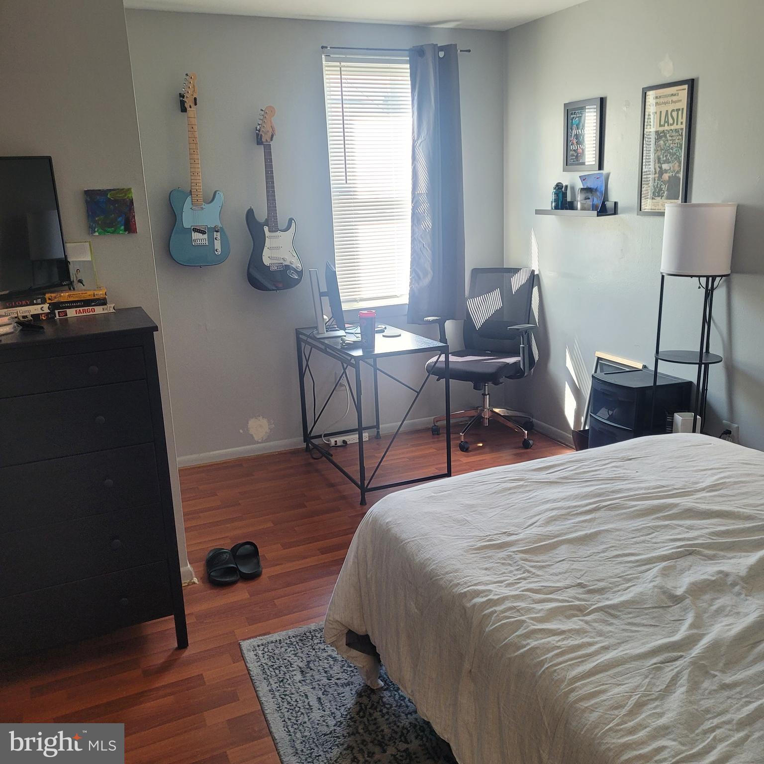 a bedroom with furniture and a window