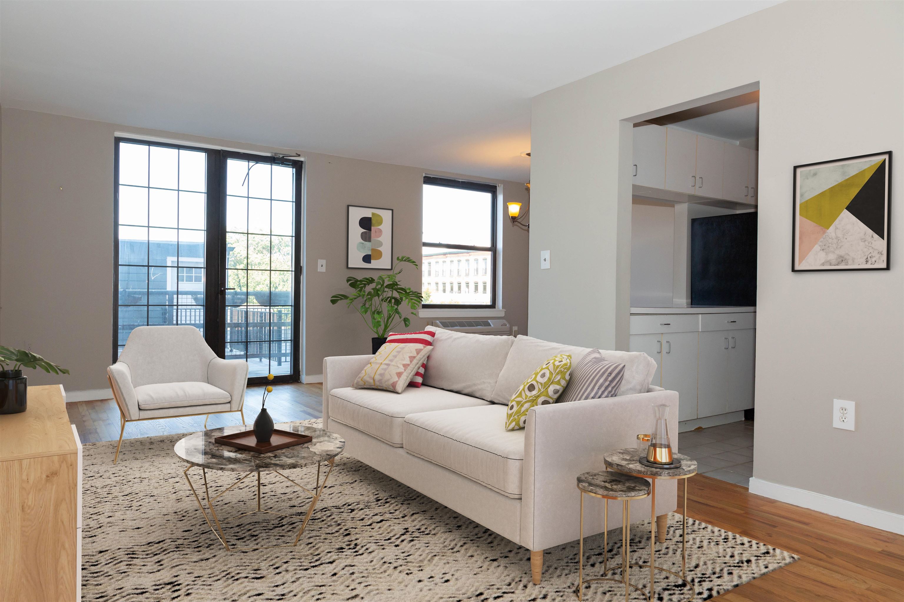 a living room with furniture and a rug