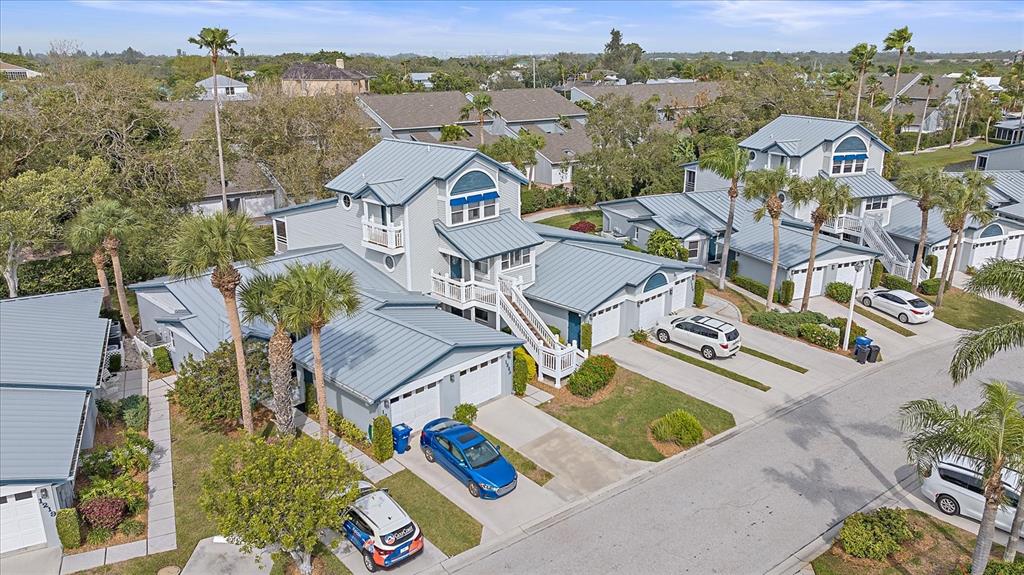 an aerial view of a house with a big yard