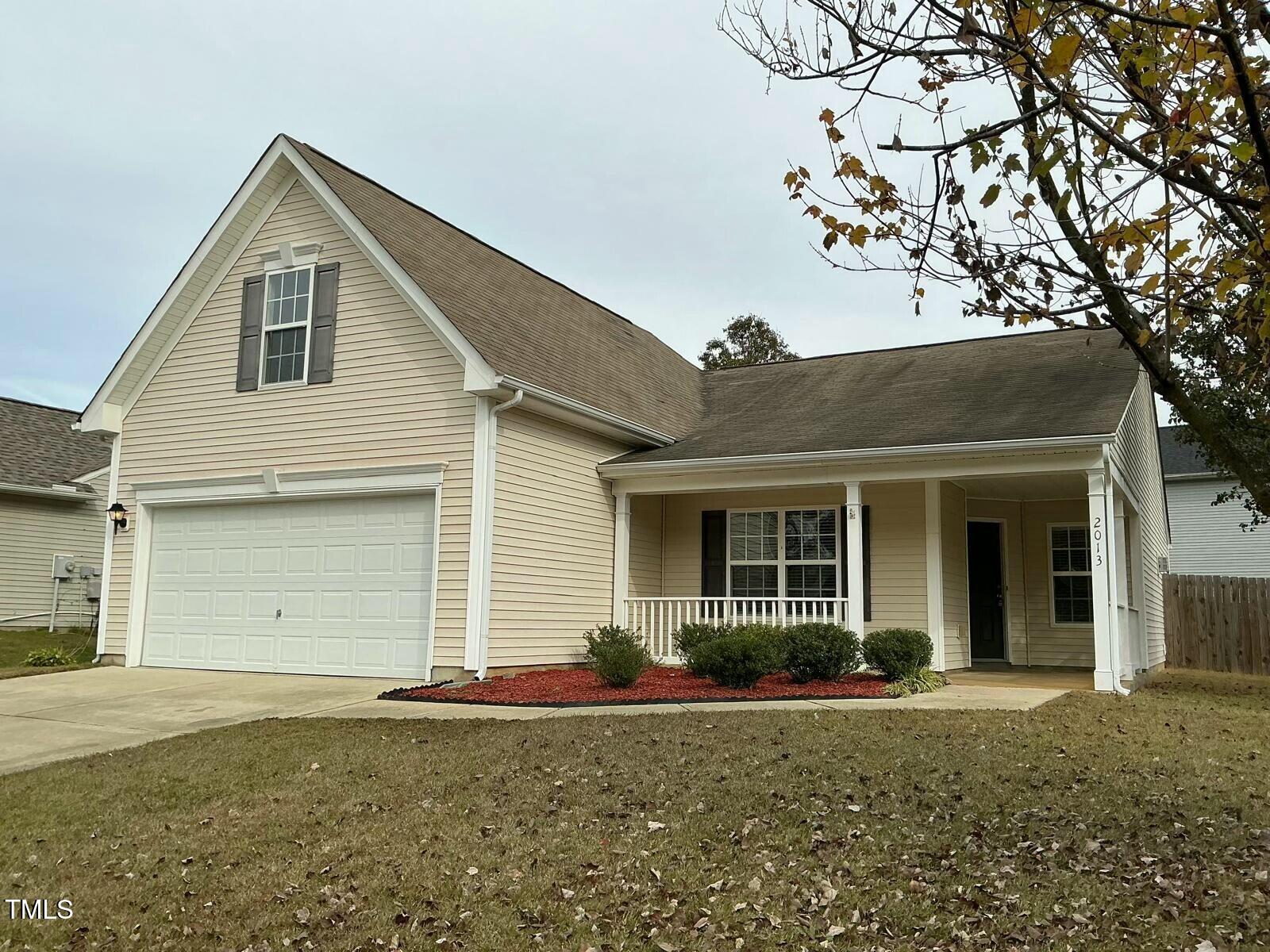 front view of a house with a garden