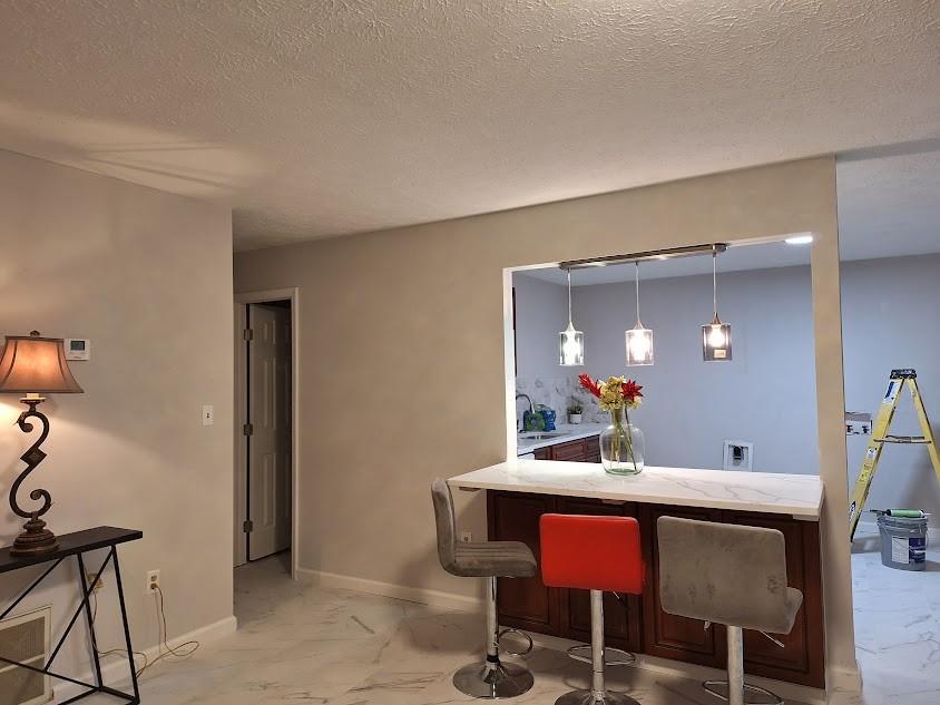 a dining room with a table and chairs