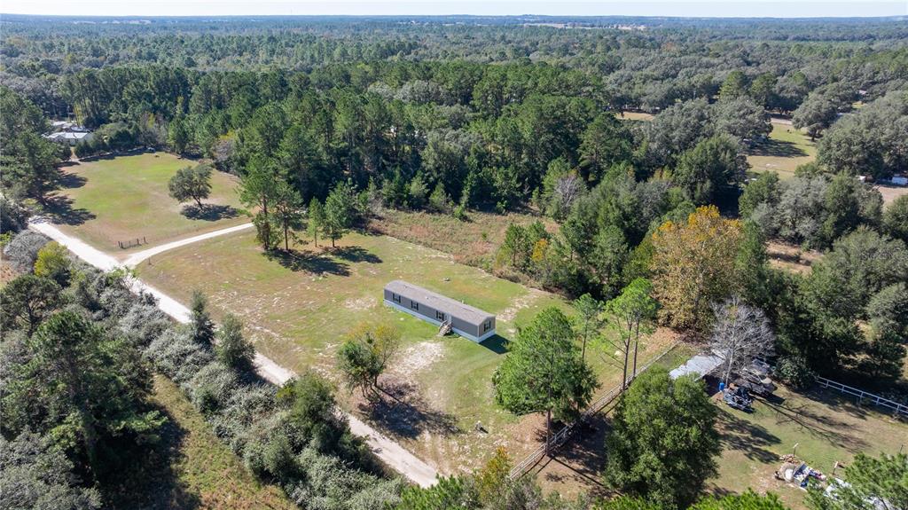 an aerial view of residential house with outdoor space