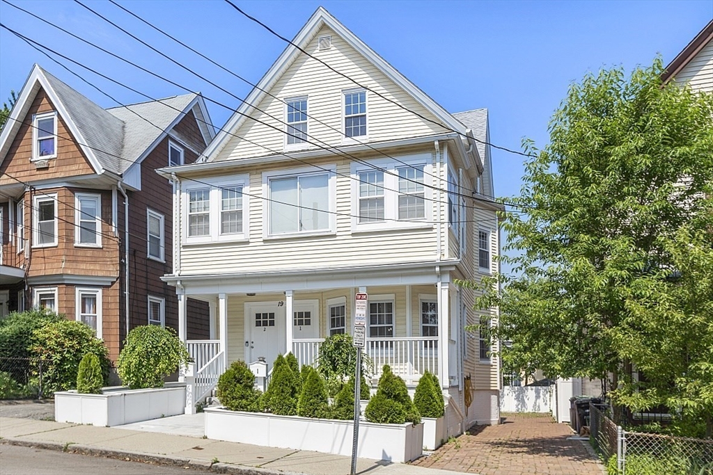 a front view of a house with a porch