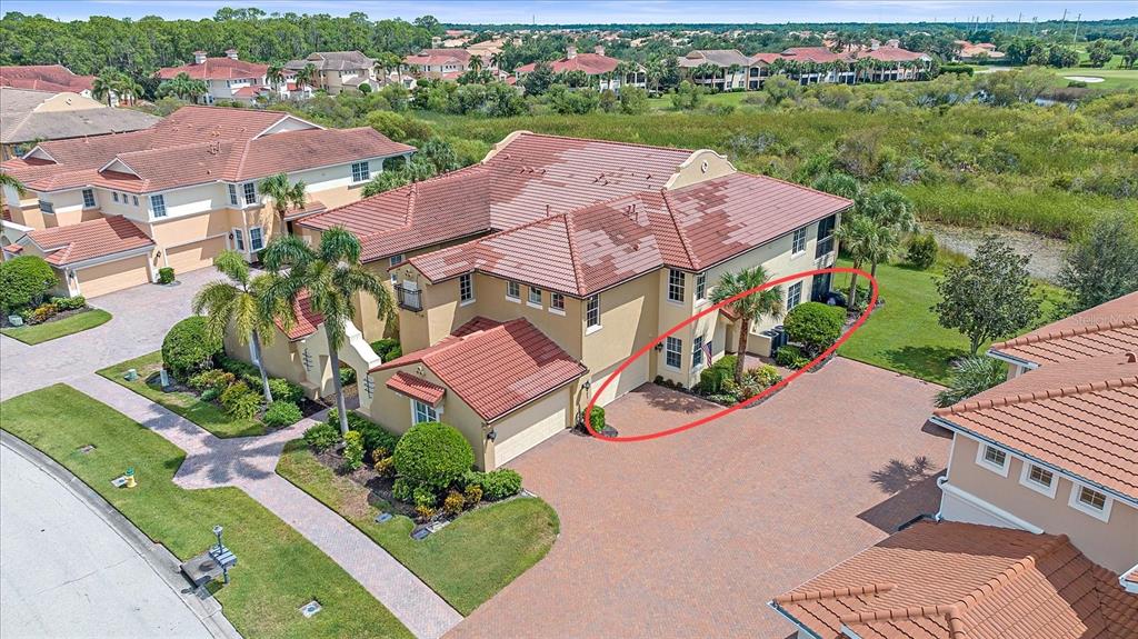 an aerial view of house with yard