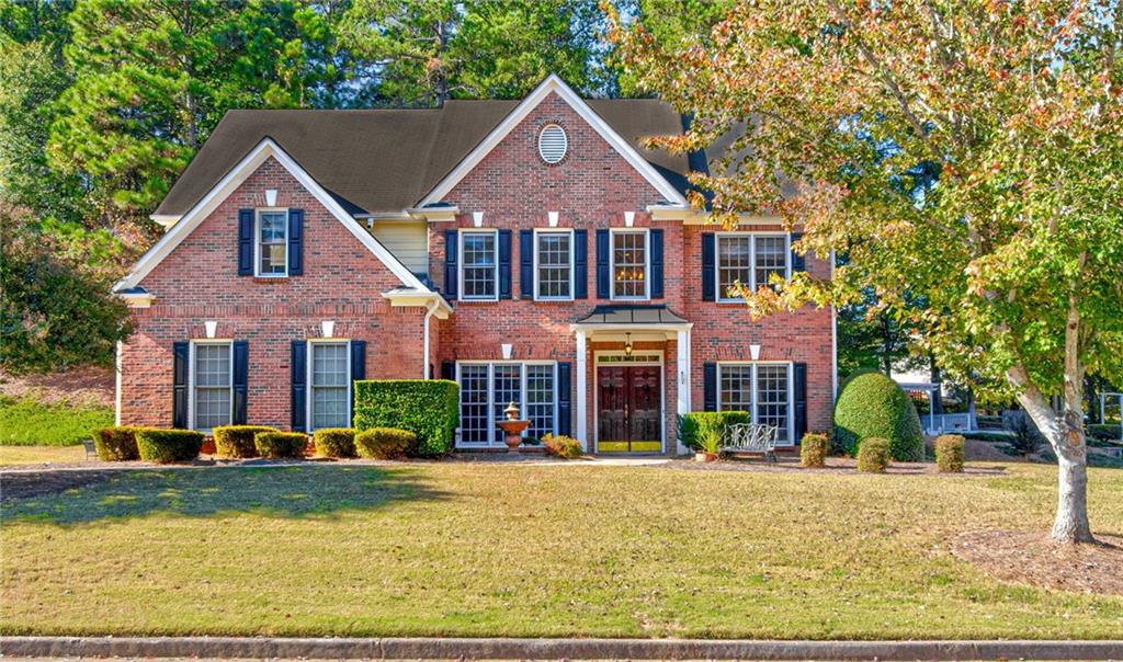 front view of a house with a yard