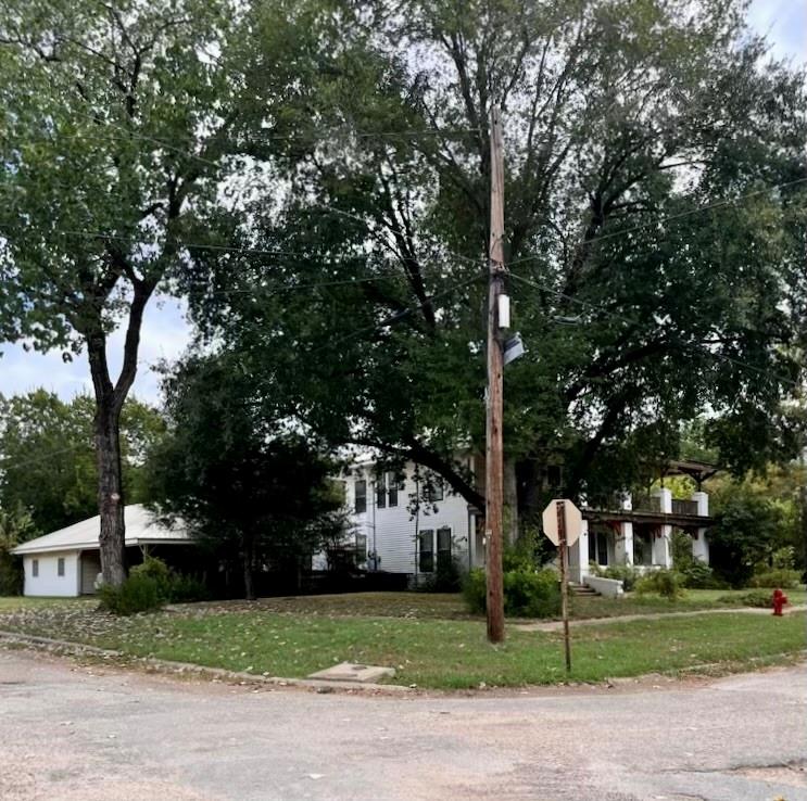 a couple of street view of a house with a yard