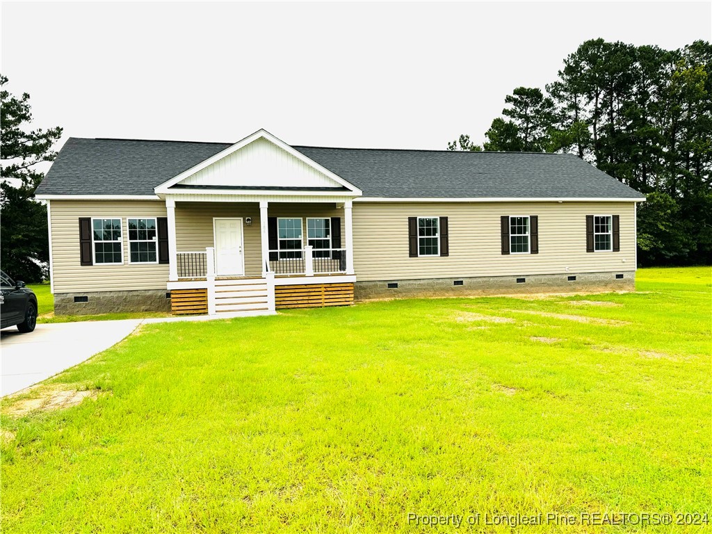 a front view of a house with yard