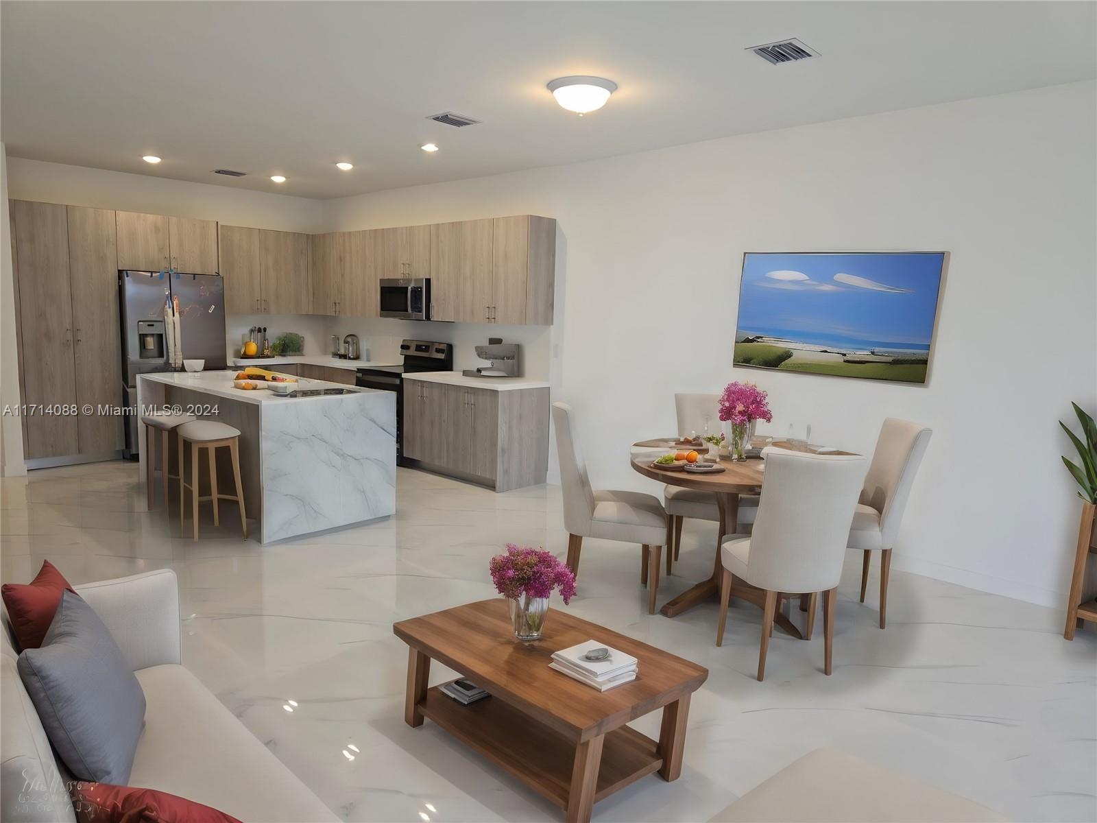 a living room with furniture kitchen view and a dining table