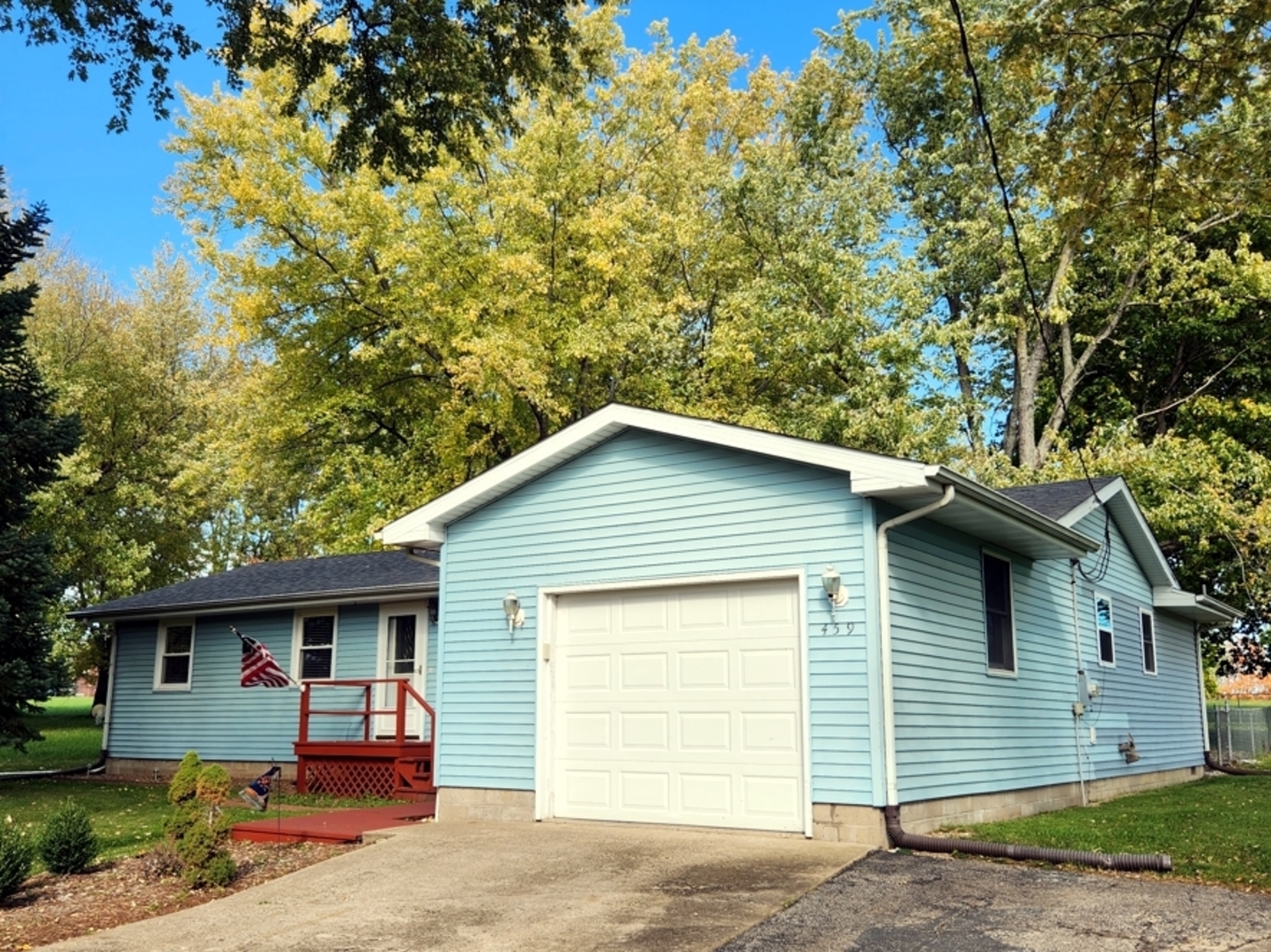 a front view of a house with a garage