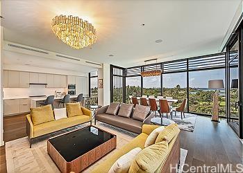 a living room with furniture and a floor to ceiling window