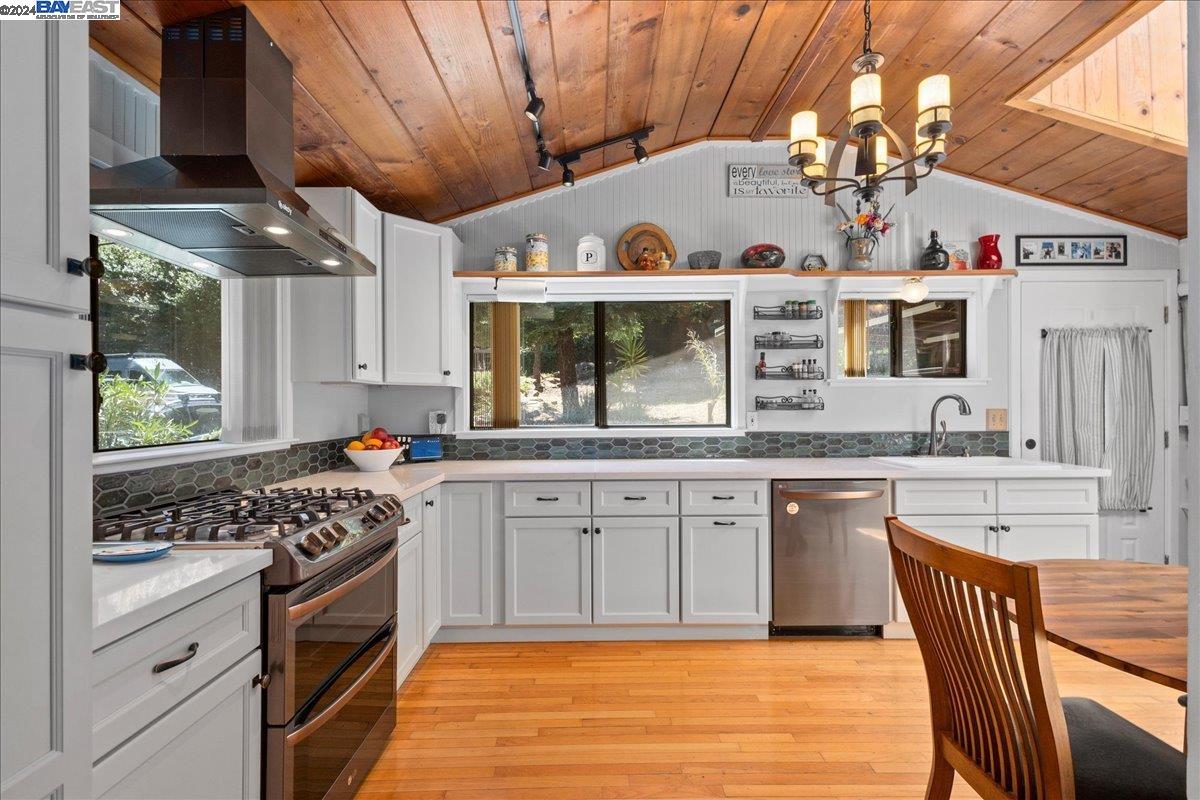 a kitchen with cabinets and window