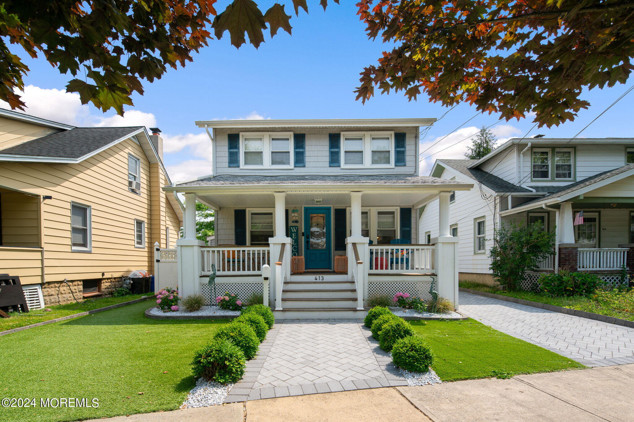 a front view of a house with a yard