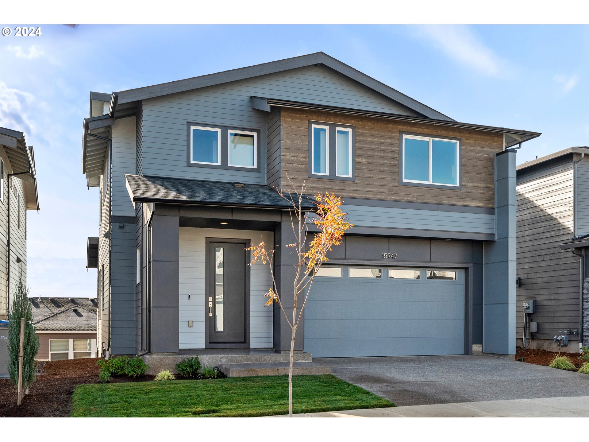 a front view of a house with garage