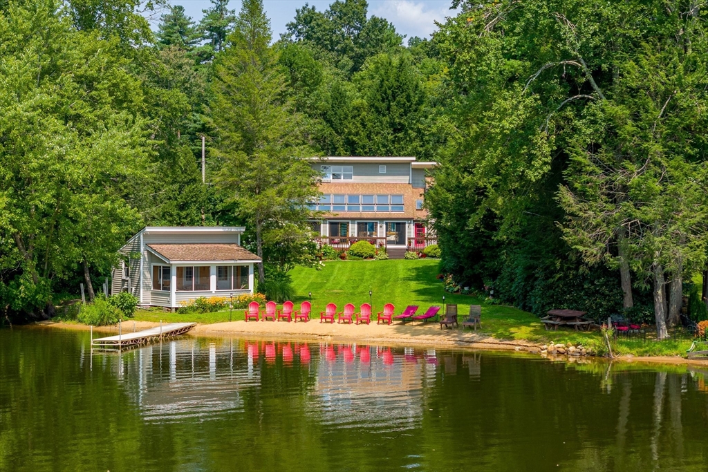 a front view of a house with a swimming pool