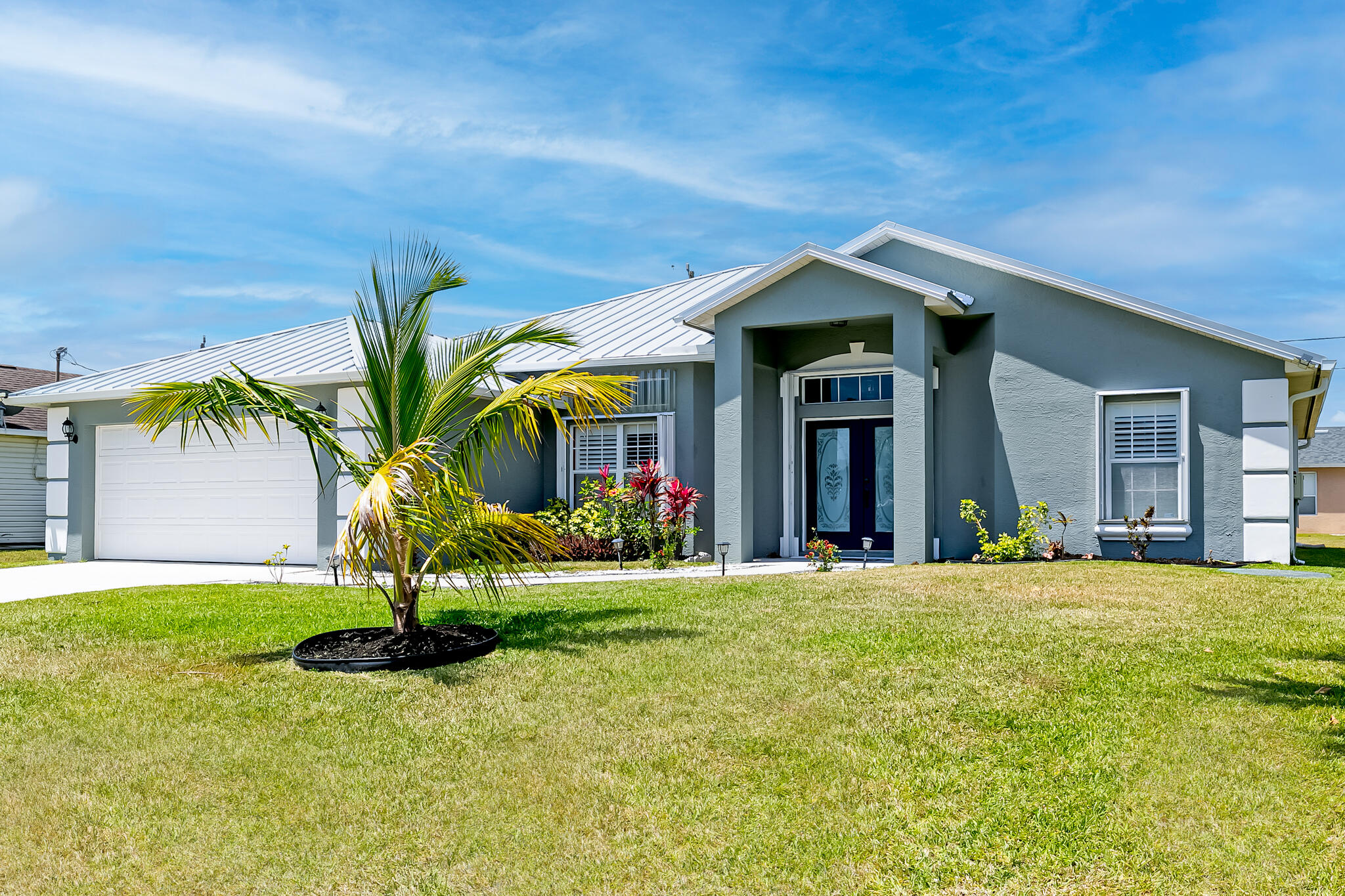 a front view of a house with a yard