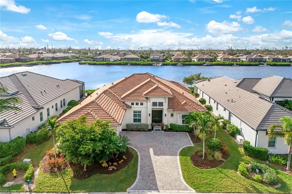 an aerial view of a house with outdoor space