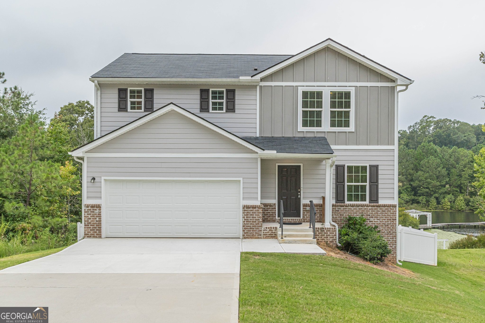 a front view of a house with a yard