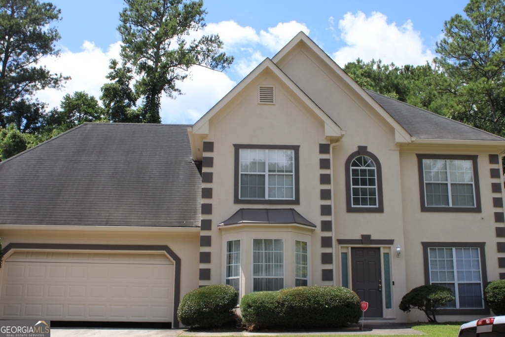 a view of multiple house with a yard