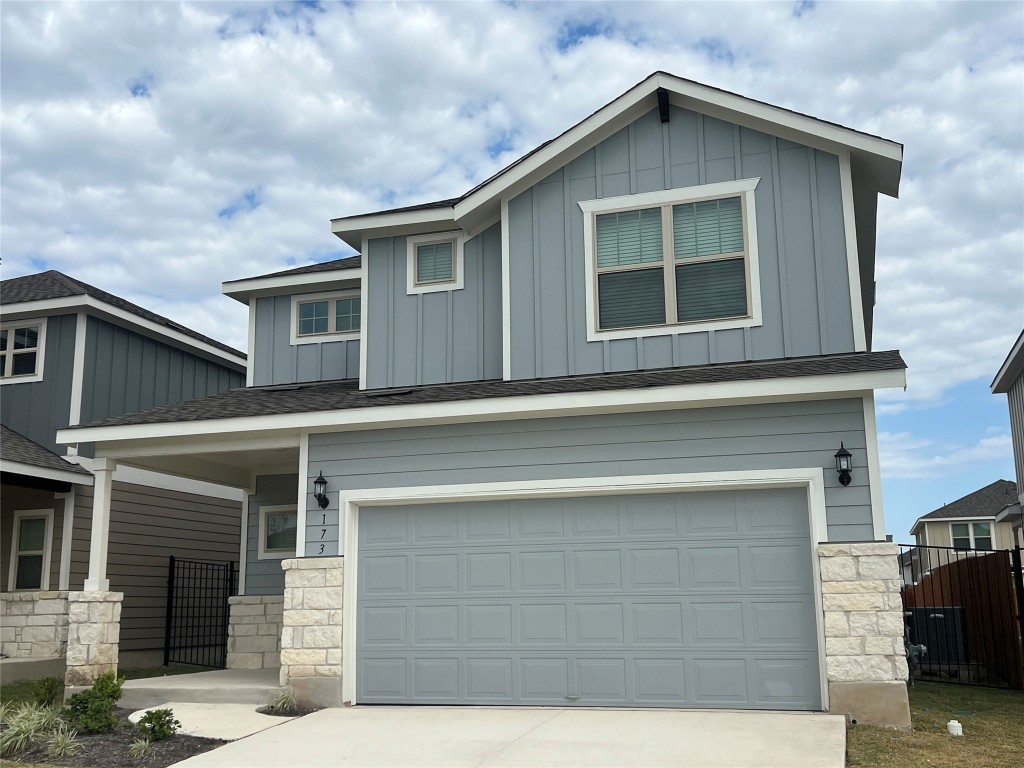 a front view of a house with garage