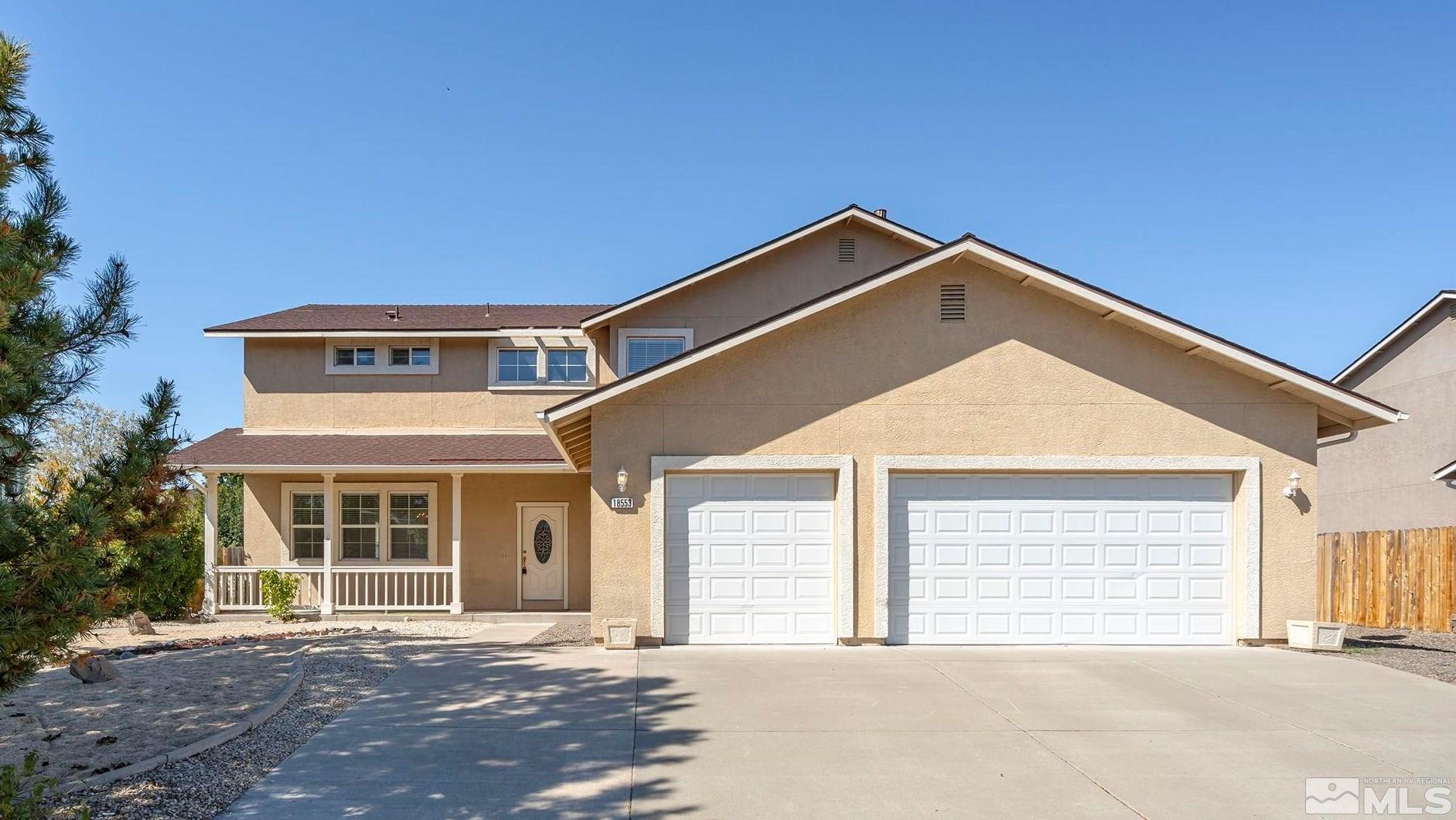 a front view of a house with a garage