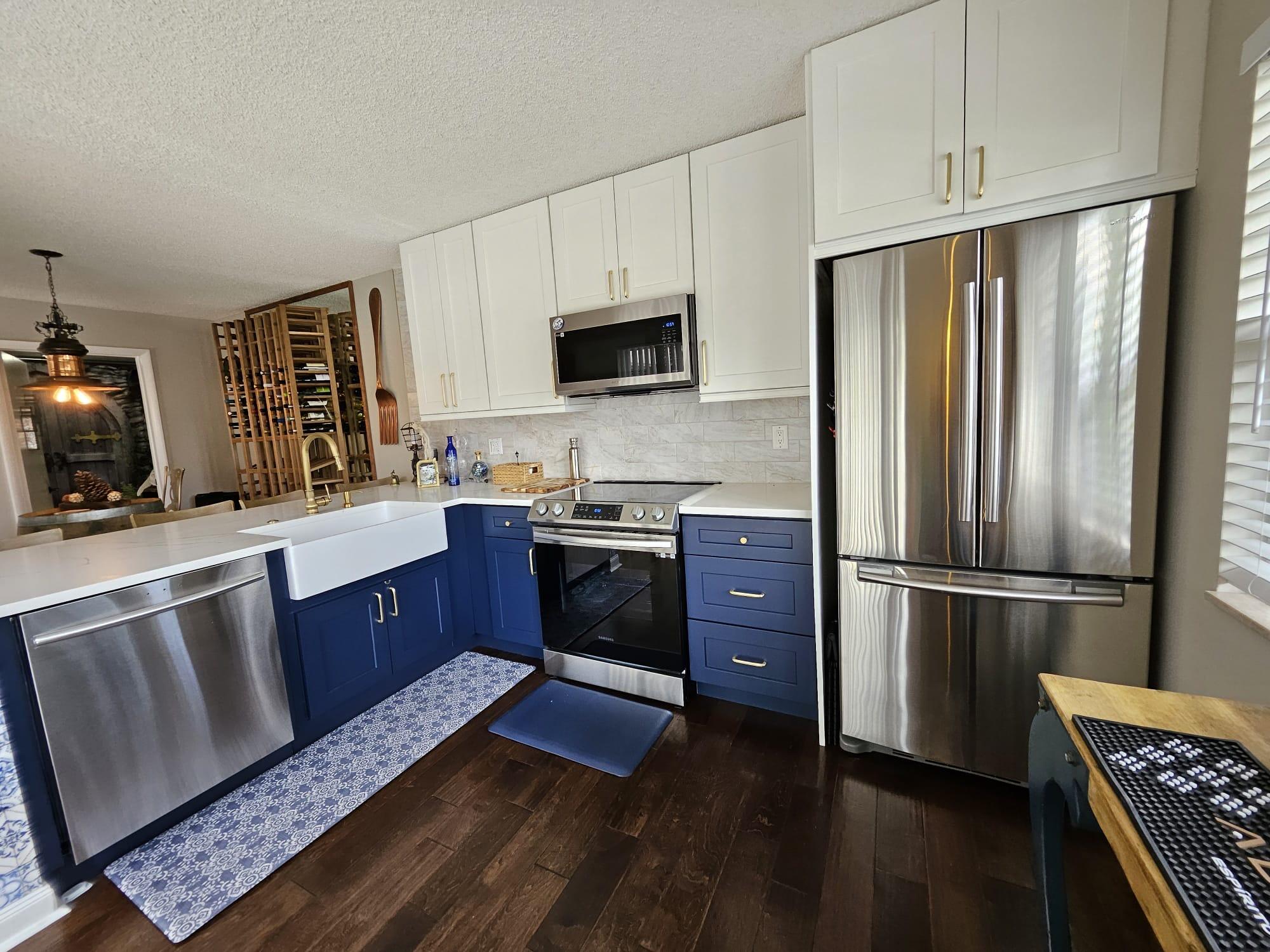 a kitchen with wooden cabinets and stainless steel appliances