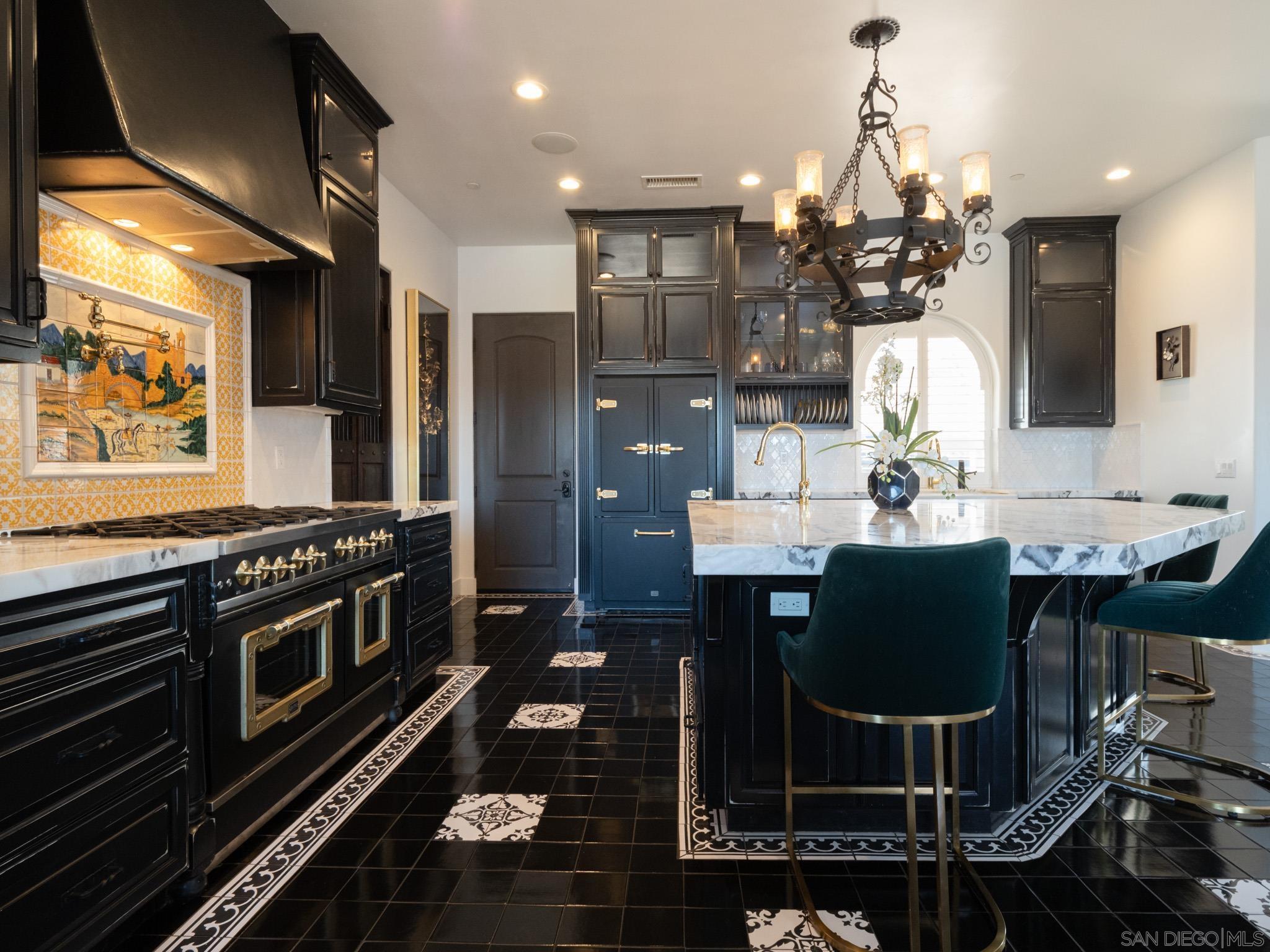 a kitchen with a dining table and chairs