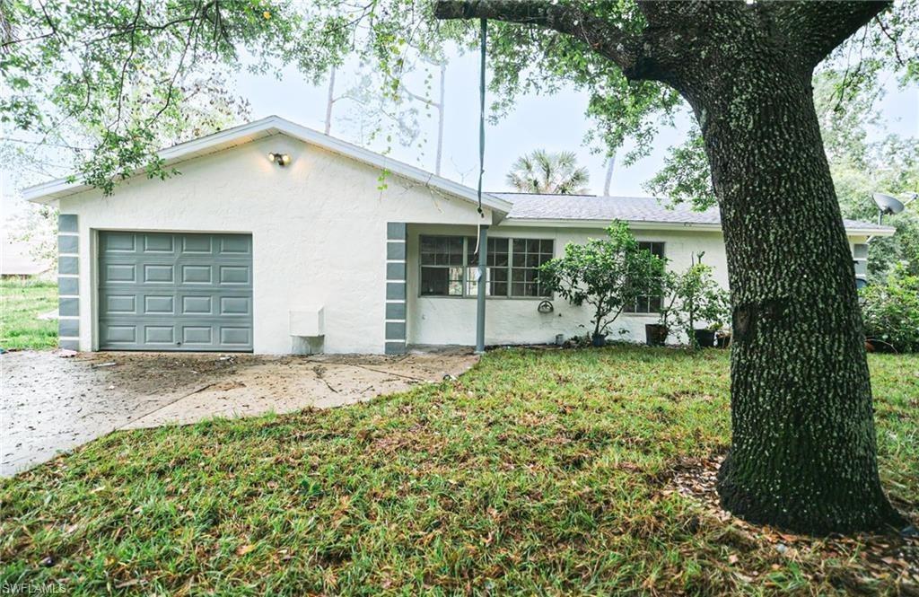 Single story home featuring a front yard