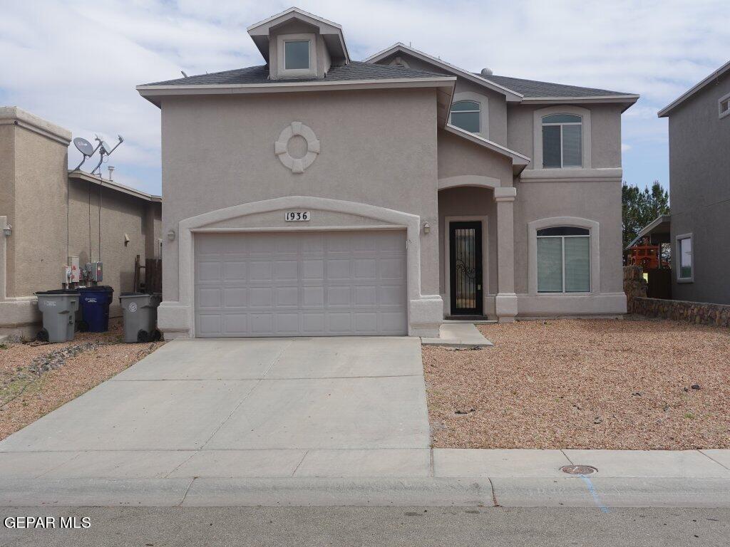 a view of a house with a parking space