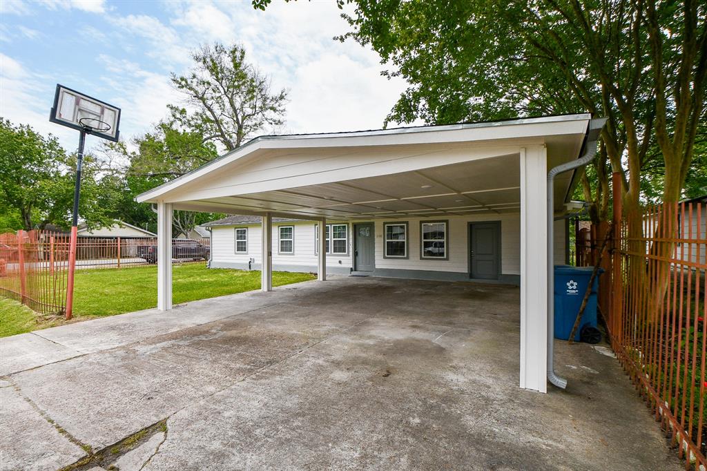 a view of a house with a yard and porch