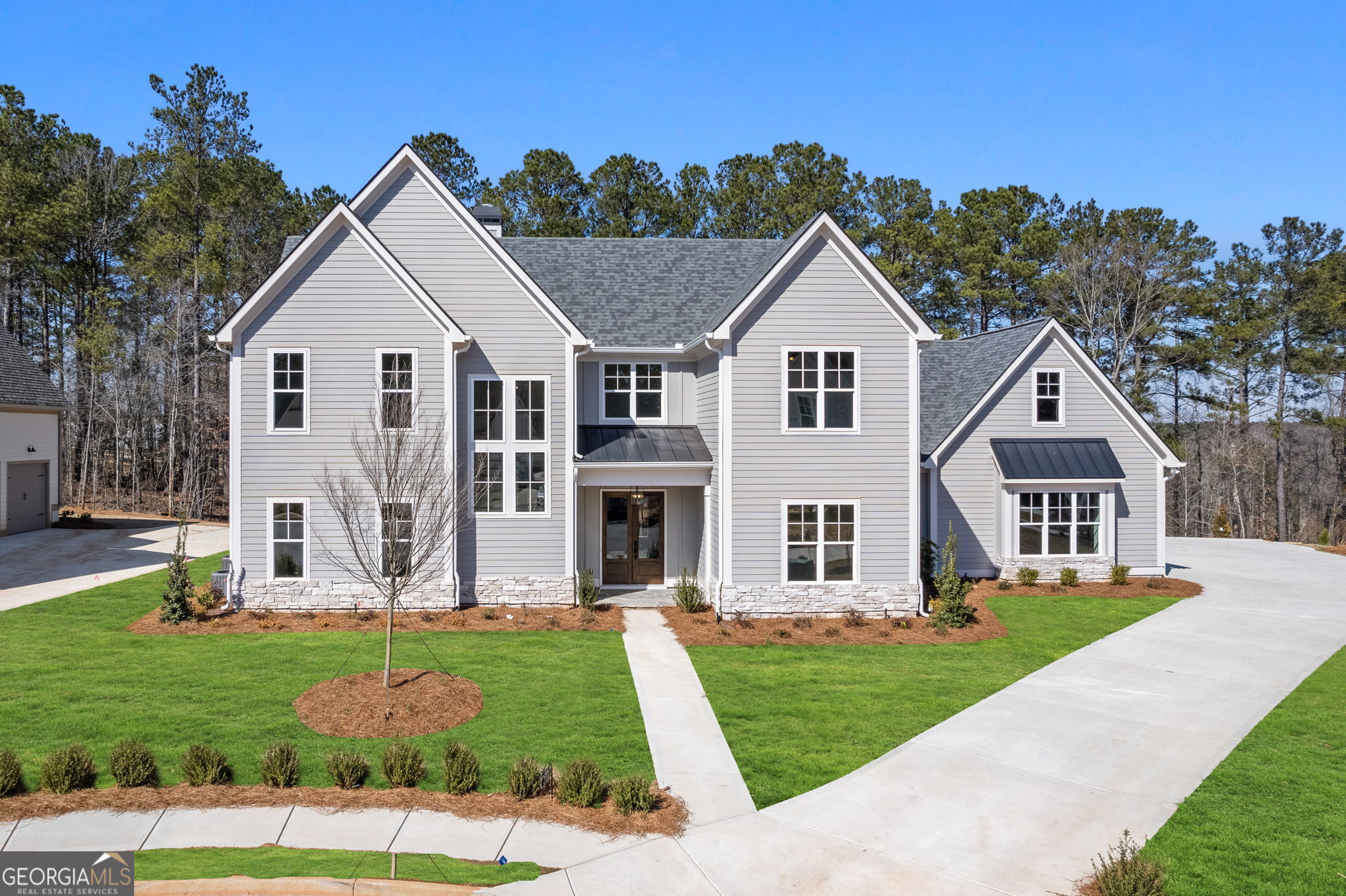 a front view of a house with a yard