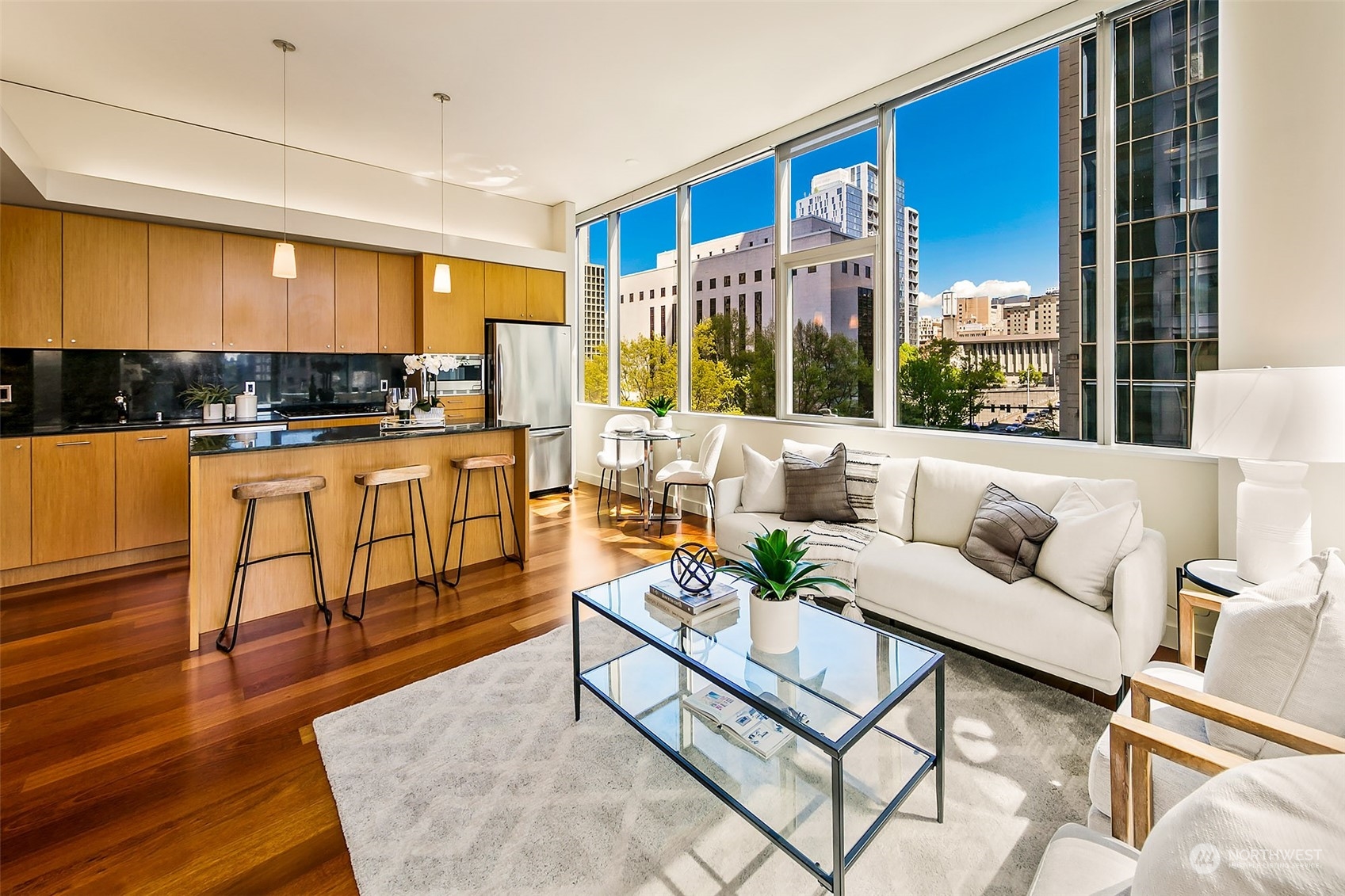 a living room with furniture and a large window