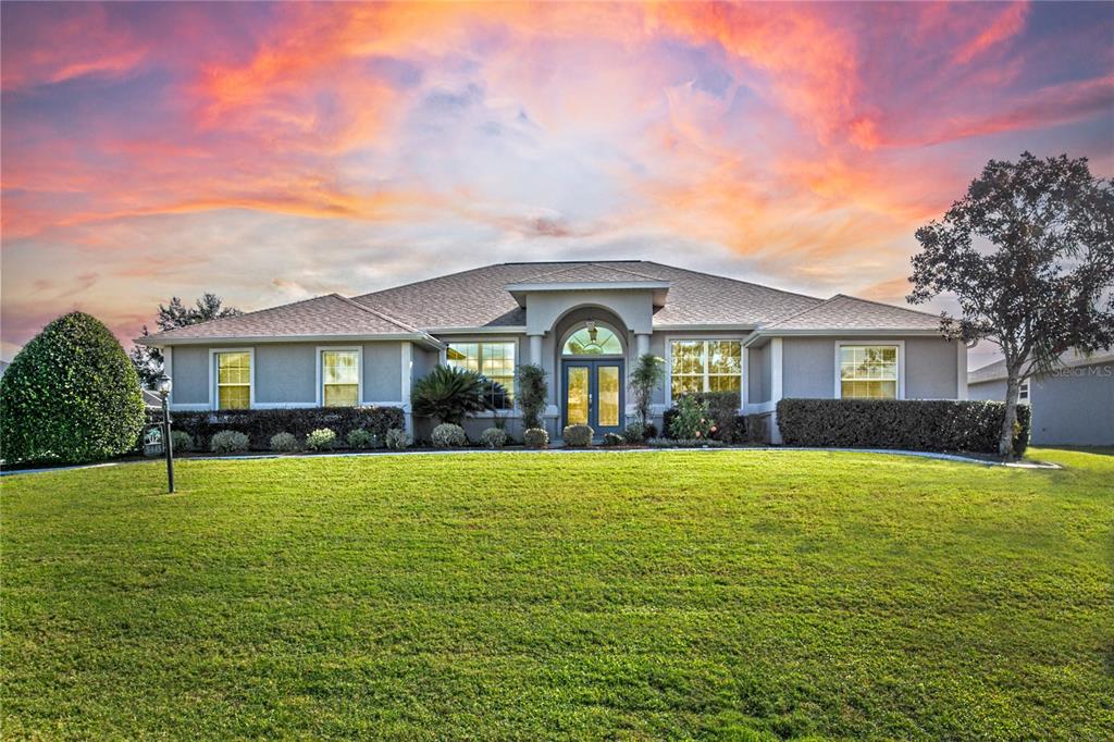 a front view of a house with a yard