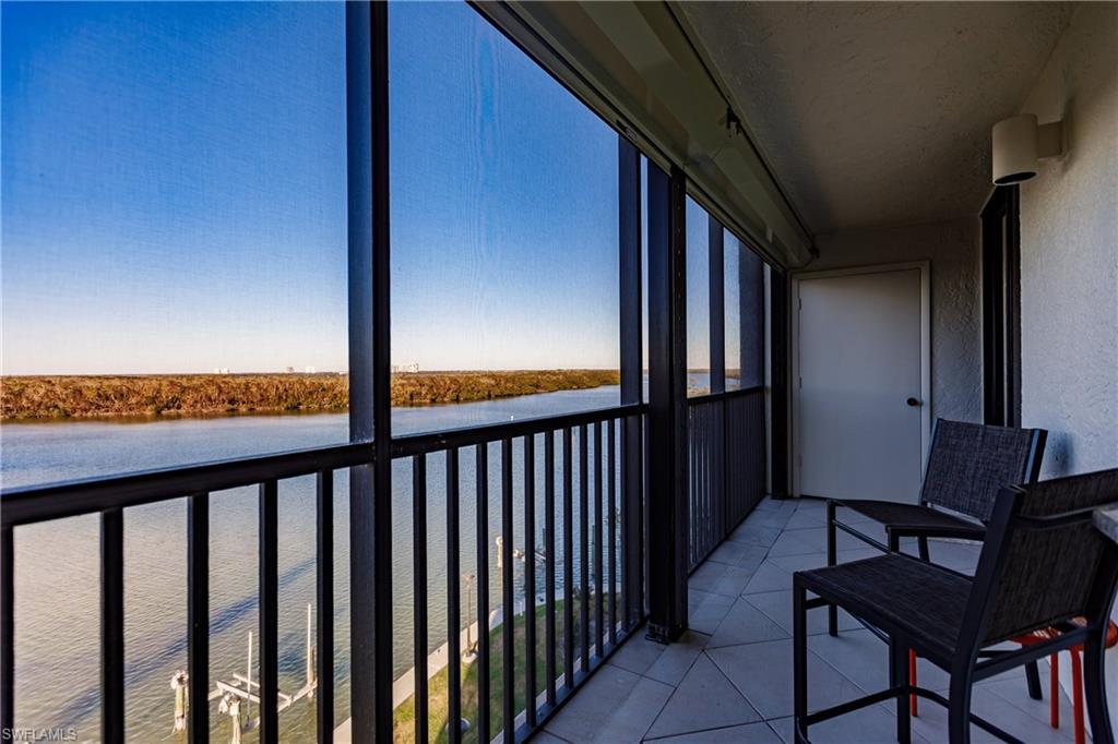 a view of a balcony with furniture