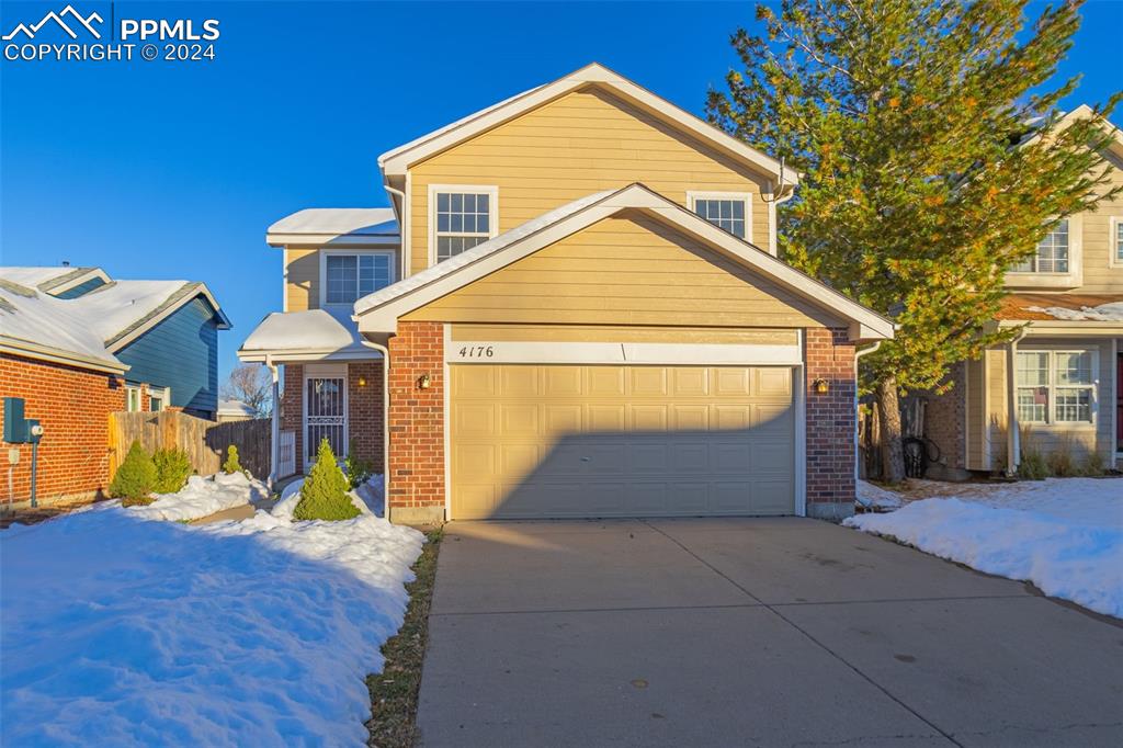 View of front property featuring a garage